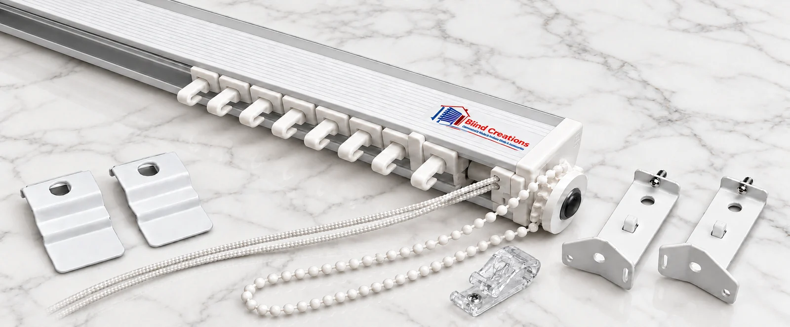 Full width white vertical blind headrail with attached carriers, cord and beaded chain